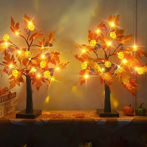 Decorative autumn light-up trees with glowing leaves and berries.