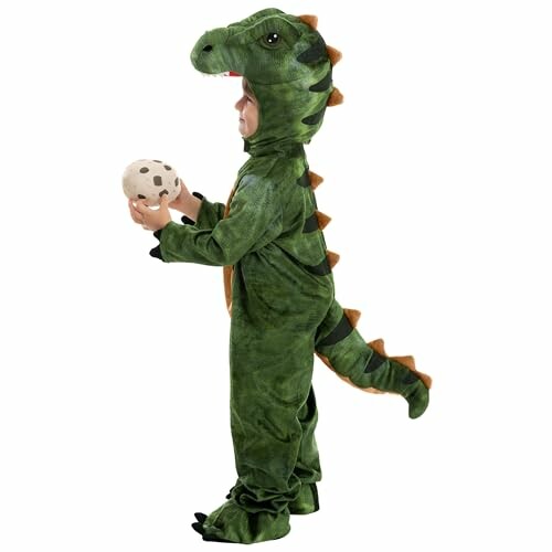 Child in dinosaur costume holding a toy egg.