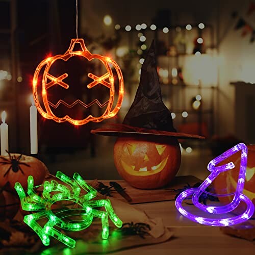 Halloween decorations with LED lights shaped as a pumpkin, spider, and witch hat.