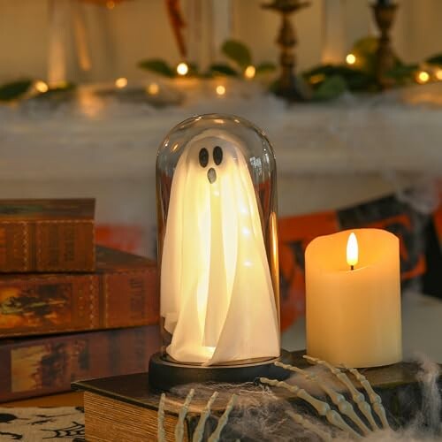 Decorative ghost lamp with candle and books